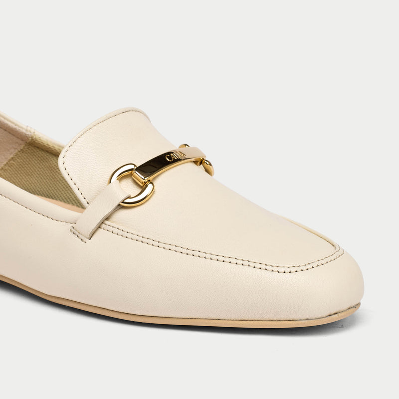 closeup of neutral leather loafers