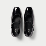 black patent mary janes pair top view