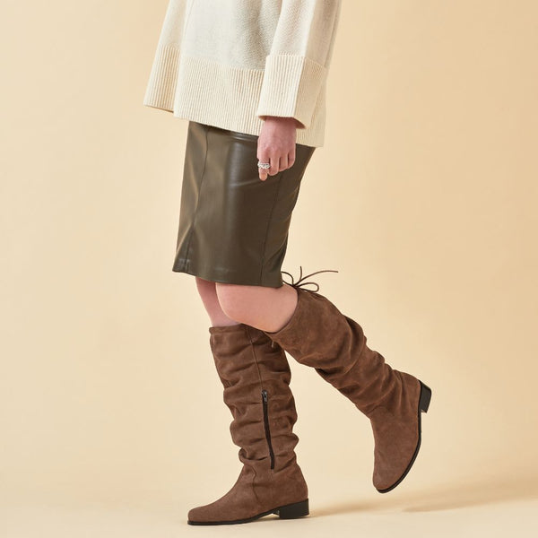 almond suede knee high boots for bunions on model